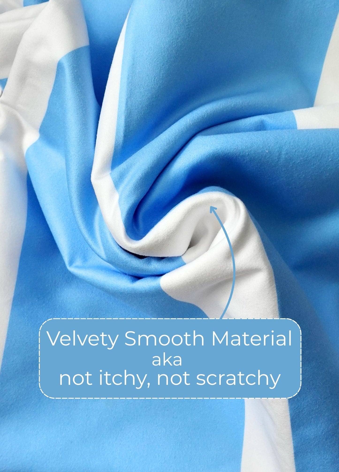 Blue and white fabric with a label describing the material as 'velvety smooth' and 'not itchy, not scratchy'.