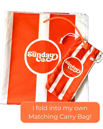 Orange and white product with 'The Sunday Co.' logo and matching carry bag.